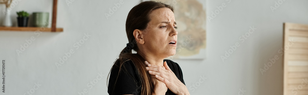 Middle-aged woman finding solace with hands on chest. Middle-aged woman finding solace with hands on chest.