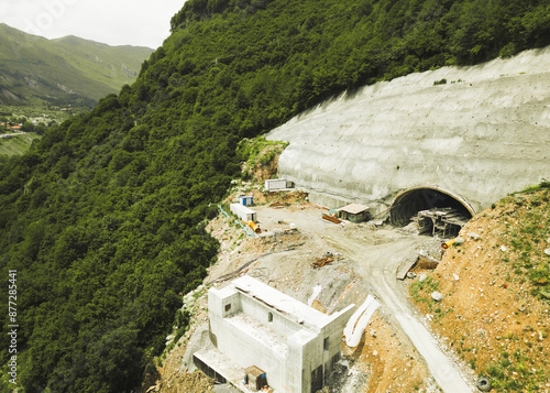 Kazbegi, Georgia - 7th july, 2024: aerial view cranes and bridge foundation pillars on construction site of new highway road project built by chinese builders.Avalanche bypass tunnel.Tbillisi - Lars photo