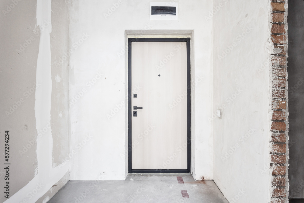 Fototapeta premium interior of the apartment without decoration in gray colors. rough finish