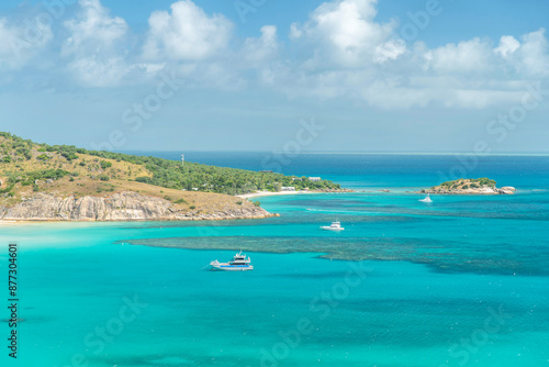 Picturesque tropical sandy Watsons Beach with turquoise water on Lizard Island, Australia. Lizard Island  is located on Great Barrier Reef in north-east part of Queensland.