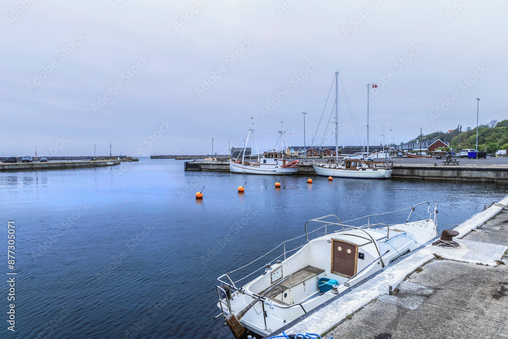Fototapeta premium Sea pier with boats on a cloudy day. High quality photo