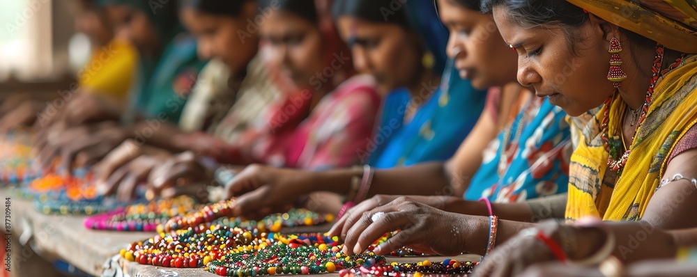 Fototapeta premium Women working together to assemble colorful beads.