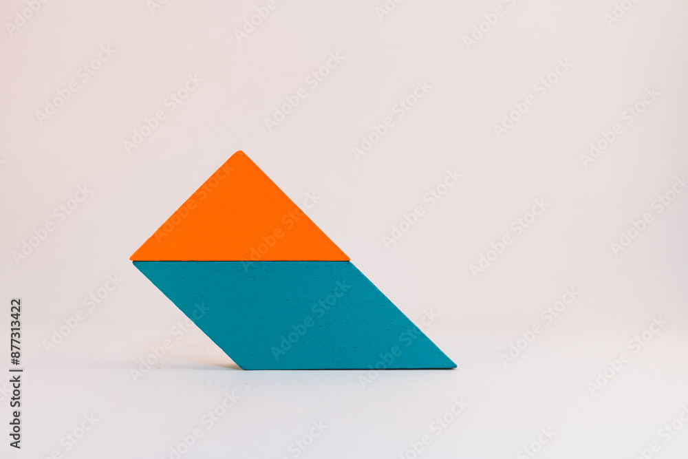 Closeup tangram puzzle on white background use for education and creative concept Closeup tangram puzzle on white background use for education and creative concept