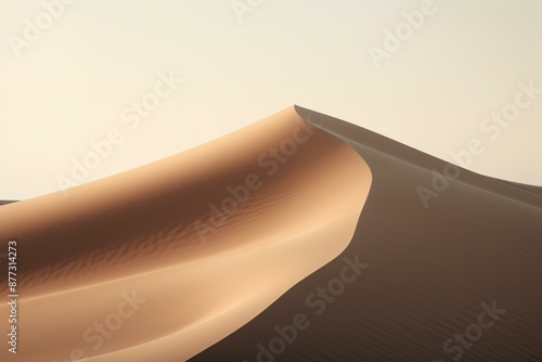 Fototapeta Naklejka Na Ścianę i Meble -  Tranquil scene of smooth sand dunes under a soft gradient sky at twilight