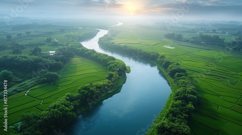 Aerial View of a River Winding Through Lush Green Fields © KRIS