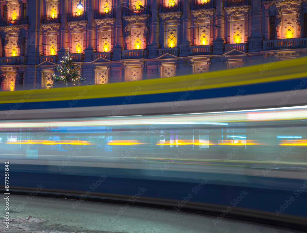 custom made wallpaper toronto digitalTram at Night in Bahnhofstrasse and Illuminated Building in Long Exposure in a Winter Night in City of Zurich, Switzerland.