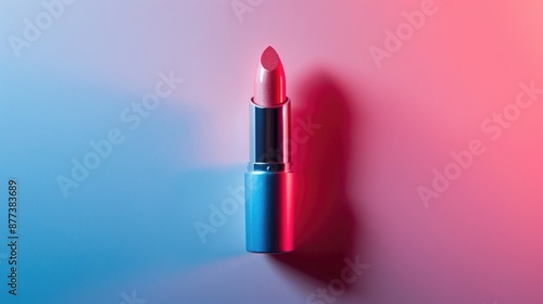 Red lipstick isolated on neon background.