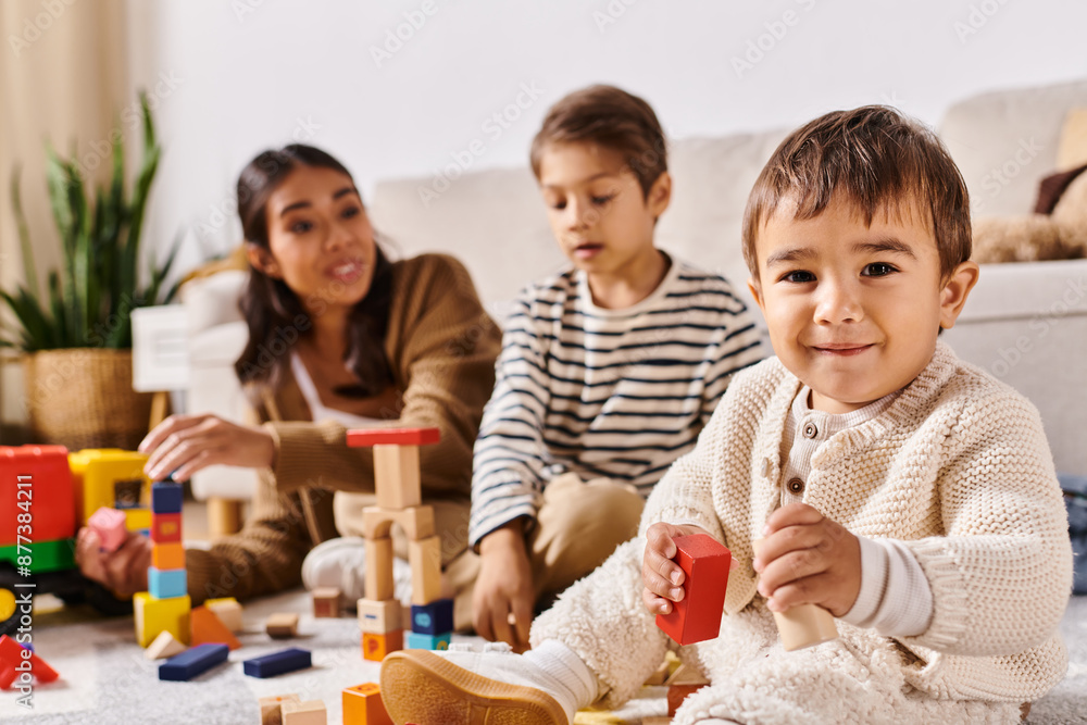 A group of children, including a young Asian mother and her little sons, playing happily with wooden toys in a cozy living room. A group of children, including a young Asian mother and her little sons, playing happily with wooden toys in a cozy living room.