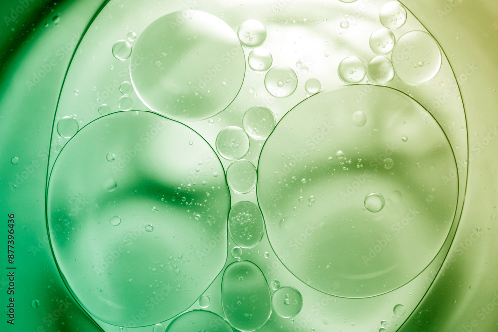 Green oil on the surface of the water separates. Green oil on the surface of the water separates.
