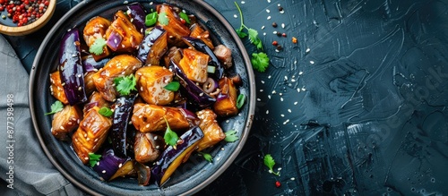 Stir fried Chinese meal featuring eggplant and pork with a copy space image