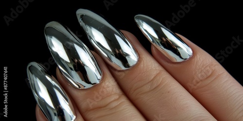 Close-up of a Hand with Long Silver Nails photo