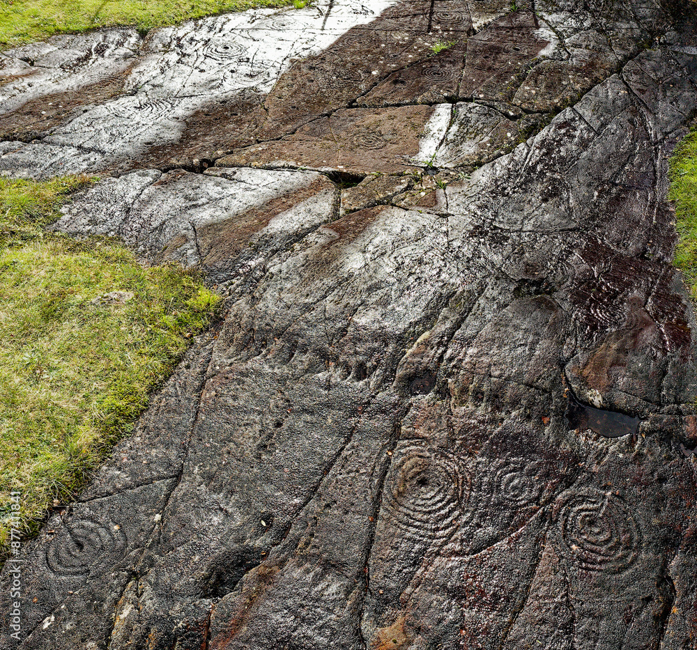 Cup and ring mark marks prehistoric Neolithic rock art on natural rock outcrop at Achnabreck in Kilmartin Valley, Argyll, Scotland, UK
