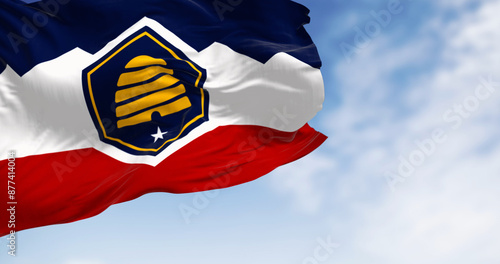 Close-up of the Beehive Flag flag of Utah waving on a clear day