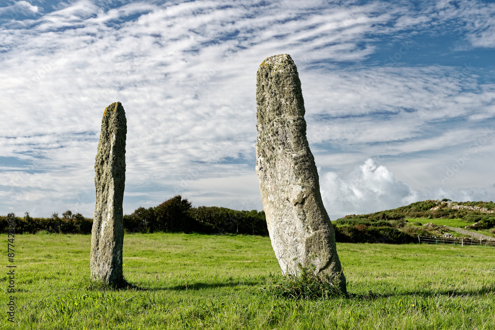 Penrhos Feilw prehistoric standing stone pair near Holyhead, Anglesey, Wales. 3m high. Neolithic or Bronze Age. View from N.E.