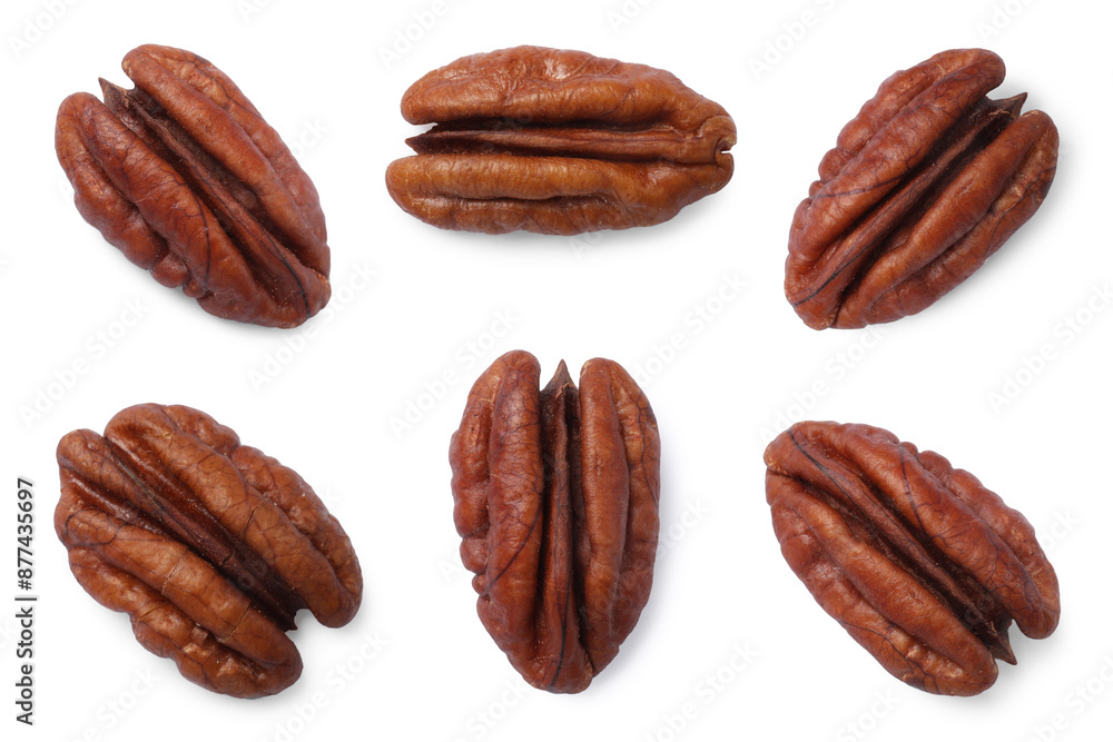 Obraz premium Many pecan nuts isolated on white, set