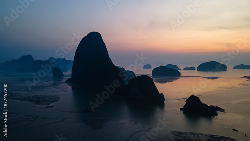 Beautiful and colorful sunrise over the sea. Large rocks in the sea. Dawn in Thailand. Colorful sky in the morning. 