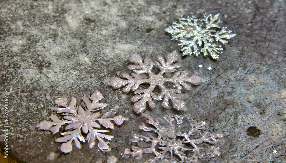 on a metallic rough background lie snowflakes winter time texture and snow on a metallic rough background lie snowflakes winter time texture and snow
