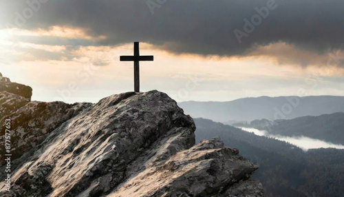 Religious Christian banner of a black and white wooden cross on a rock hilltop.