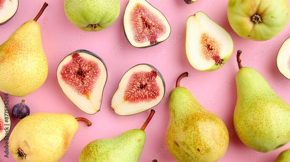 Group of halved pears on pink surface with some pieces removed Group of halved pears on pink surface with some pieces removed