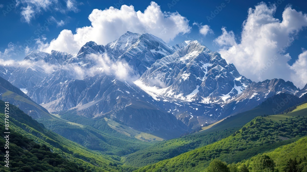 Majestic snow-capped mountain peak towering over lush green valleys, under a bright blue sky with fluffy clouds. Concepts. nature, landscape, scenery, travel, adventure, hiking. Majestic snow-capped mountain peak towering over lush green valleys, under a bright blue sky with fluffy clouds. Concepts. nature, landscape, scenery, travel, adventure, hiking.