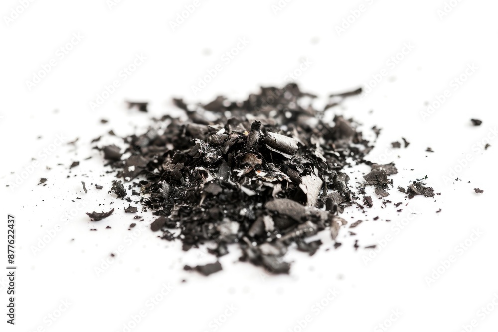 A pile of crushed chocolate on a white surface, suitable for use in food or beauty editorial content A pile of crushed chocolate on a white surface, suitable for use in food or beauty editorial content