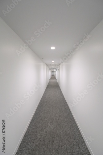 Liminal space empty white corridor 