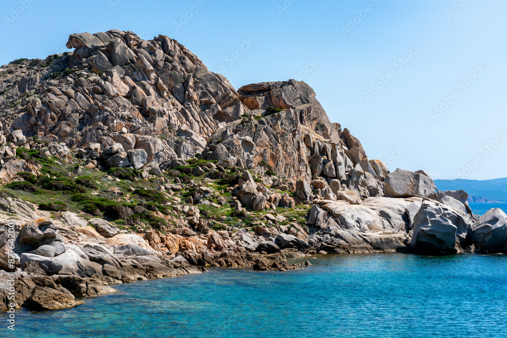 Naklejka premium Sardinia white rock coast in Capo Testa and turquoise water on a sunny day, in Italy