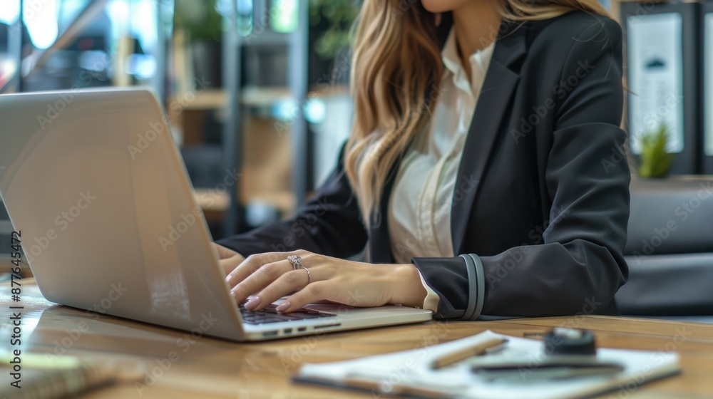 A woman typing on laptop A woman typing on laptop