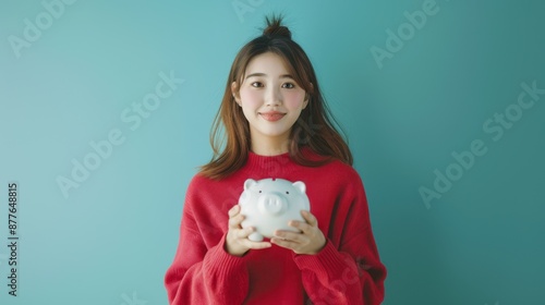 Woman Holding Piggy Bank