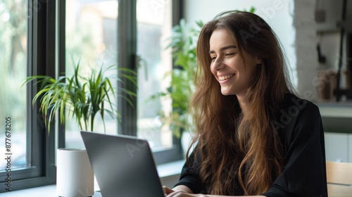 The woman working on laptop