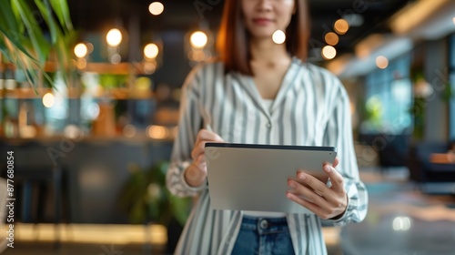 Wallpaper Mural Modern Young Businesswoman Holding Tablet with Copy Space in Blurry Coworking Space Background Torontodigital.ca