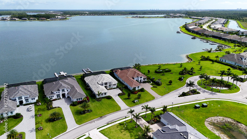 Aerial drone photo of luxury houses in Southwest Florida. Luxury real estate investment background, with large lake in Florida golf community.