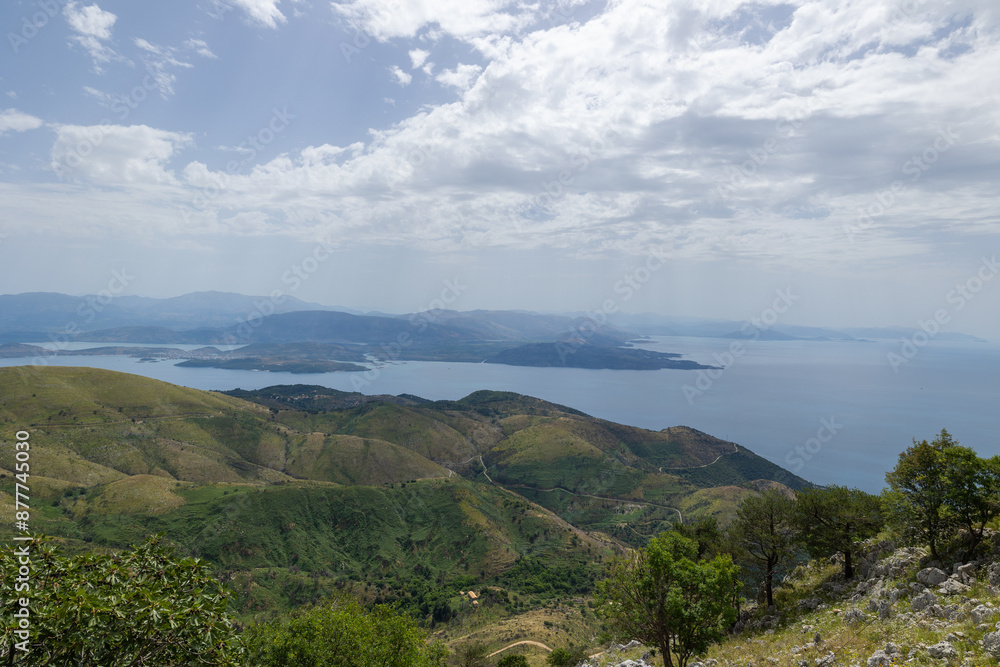 Scenic views across the Strait of Corfu towards the Albanian coastal city of Ksamil from Mount Pantokrator Scenic views across the Strait of Corfu towards the Albanian coastal city of Ksamil from Mount Pantokrator
