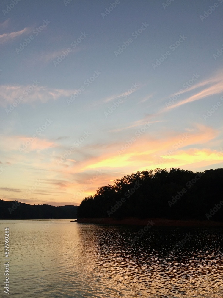 lake sunset with mountains in background lake sunset with mountains in background