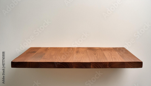 Brown wood shelf on wall background