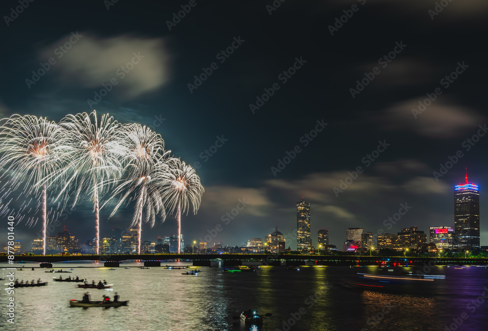 Naklejka premium July 4th fireworks over Charles River and Boston skyline