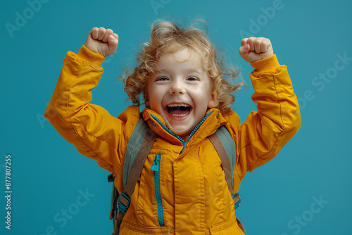 Joyful Little Boy Celebrates Victory photo