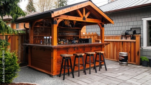 handcrafted wooden Craftsman-style outdoor bar, featuring a roof, bar stools, and space for a kegerator, creating the ultimate backyard party destination