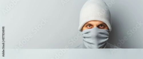 Full body shot of a burglar looking over shoulder with copy space on clear white background, natural lighting photo