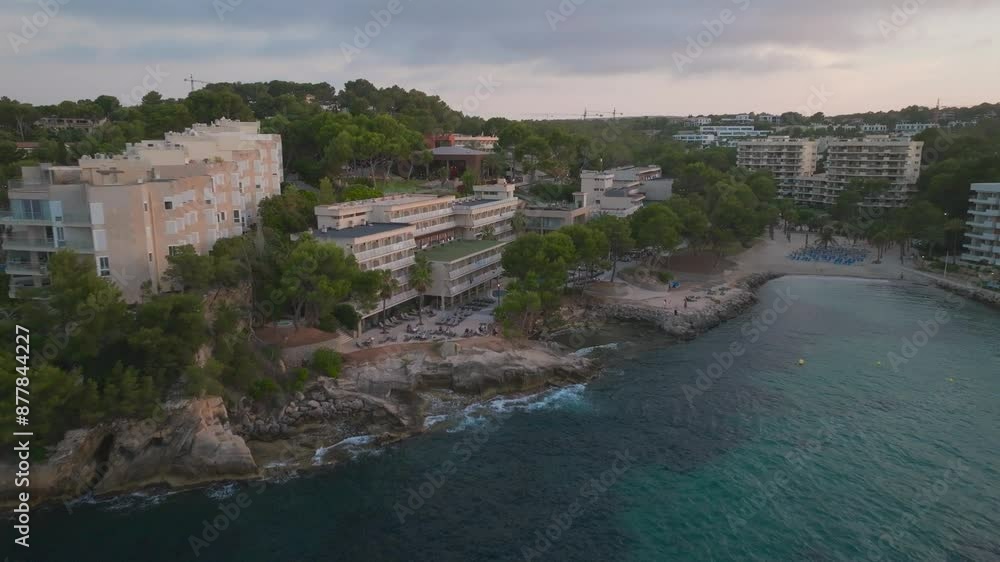 Aerial - coastal multistory beach front hotels near turquoise bay, Mallorca Aerial - coastal multistory beach front hotels near turquoise bay, Mallorca