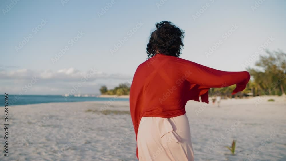 Happy woman enjoying her time on beach, playing and walking in a stylish dress. The sunny weather, sandy shores, and carefree atmosphere capture the essence of summer fun and happiness by the ocean. Happy woman enjoying her time on beach, playing and walking in a stylish dress. The sunny weather, sandy shores, and carefree atmosphere capture the essence of summer fun and happiness by the ocean.