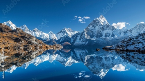 Wallpaper Mural A tranquil lake nestled among snow-capped mountains, reflecting the rugged peaks and clear blue sky above, offering a sense of serenity and awe. Torontodigital.ca