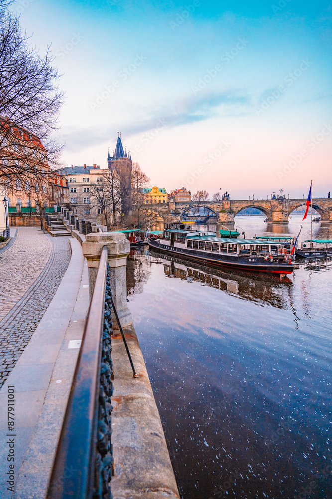 Obraz premium View of the city of Prague castle, boat trips and the Vltava river with Charles bridge in Prague, Czech Republic.