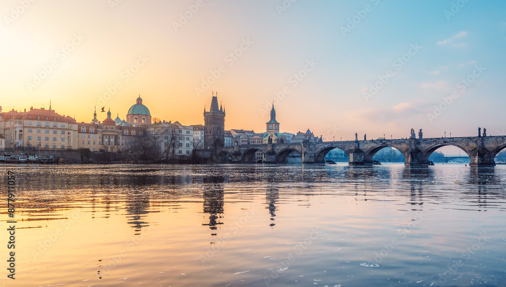 View of the city of Prague. Vltava river with Old Town Bridge Tower on Charles bridge in Prague, Czech Republic. View of the city of Prague. Vltava river with Old Town Bridge Tower on Charles bridge in Prague, Czech Republic.