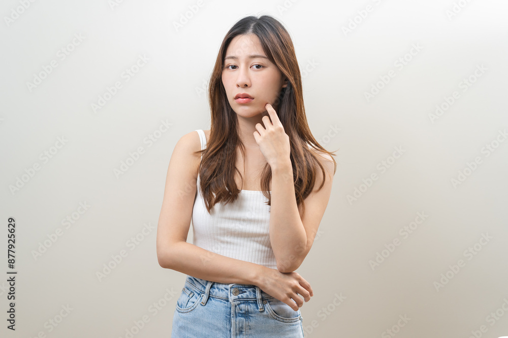 Dermatology, puberty asian young woman expression face worry, reaction from cosmetic, dark spot. Beauty care skin problem treatment, blemish wrinkle, freckles from sunlight isolated on background. Dermatology, puberty asian young woman expression face worry, reaction from cosmetic, dark spot. Beauty care skin problem treatment, blemish wrinkle, freckles from sunlight isolated on background.