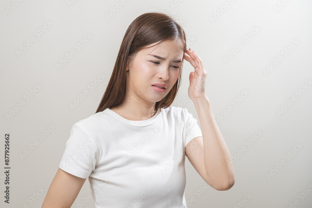 Dizzy asian young woman, girl headache or migraine pain suffering from vertigo while sitting on couch in living room at home, holding head with hand, health problem of brain or inner ear not balance. Dizzy asian young woman, girl headache or migraine pain suffering from vertigo while sitting on couch in living room at home, holding head with hand, health problem of brain or inner ear not balance.