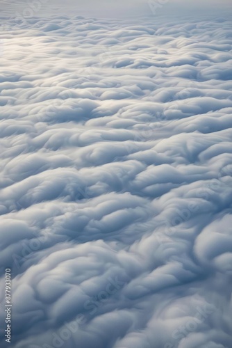 Stratocumulus clouds drifting in parallel rows, their low-lying formations creating a sense of depth and perspective in the vast, Generative AI 