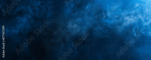 A dark blue and black abstract background with a grainy texture resembling outer space This moody and atmospheric design is perfect for creating posters wallpapers