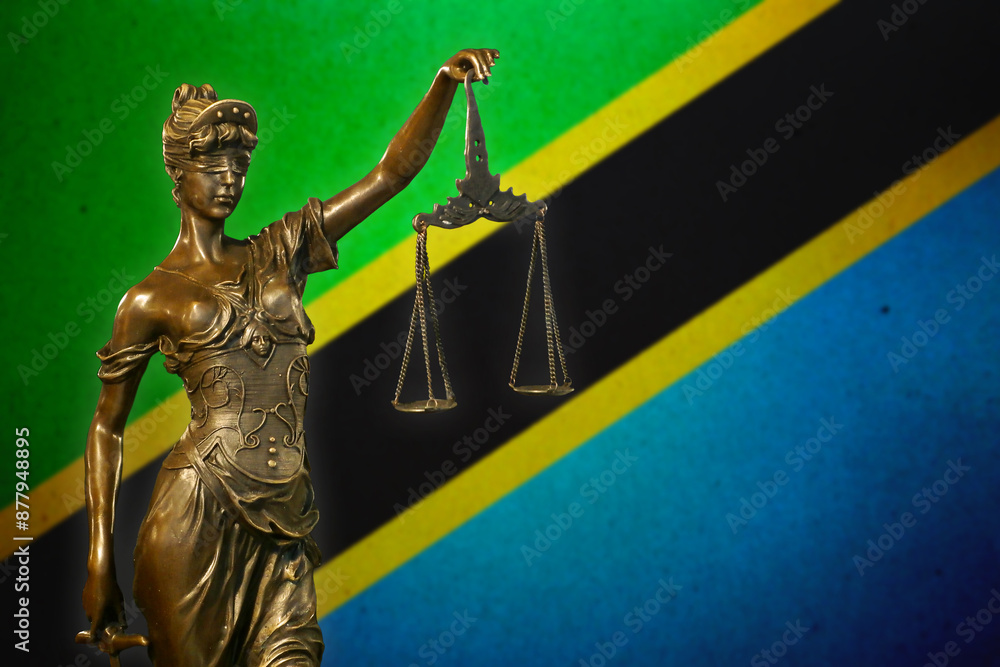 Obraz premium Lady Justice before a flag of Tanzania