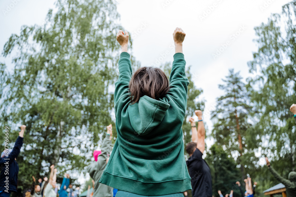 In an outdoor community event, a group is joyfully celebrating, showcasing diversity, togetherness, and cheer in a lively atmosphere filled with happiness and excitement In an outdoor community event, a group is joyfully celebrating, showcasing diversity, togetherness, and cheer in a lively atmosphere filled with happiness and excitement